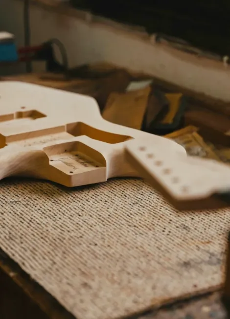 Custom cut wood guitar parts.